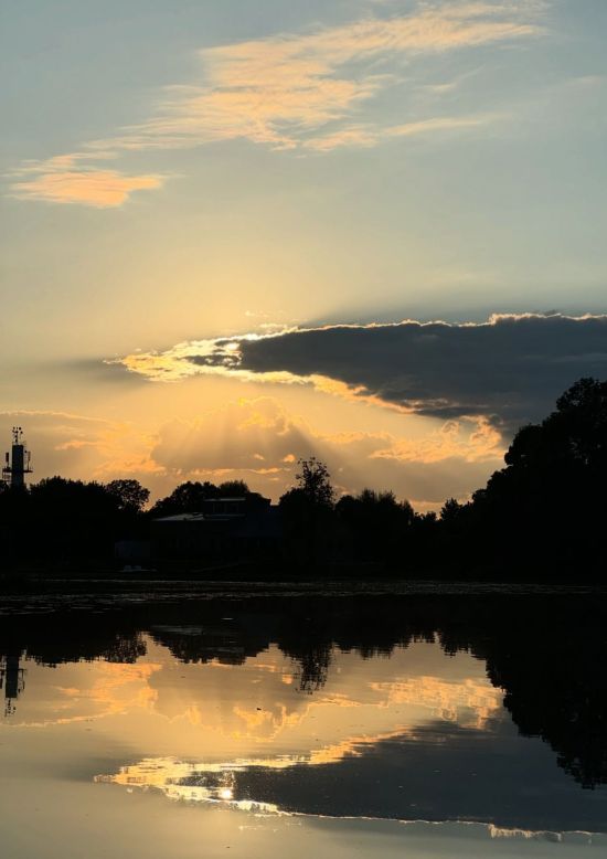 Sunrise on a SUP board at the Rundāle Watermill Lake
