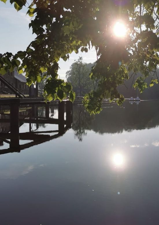 Sunrise on a SUP board at the Rundāle Watermill Lake